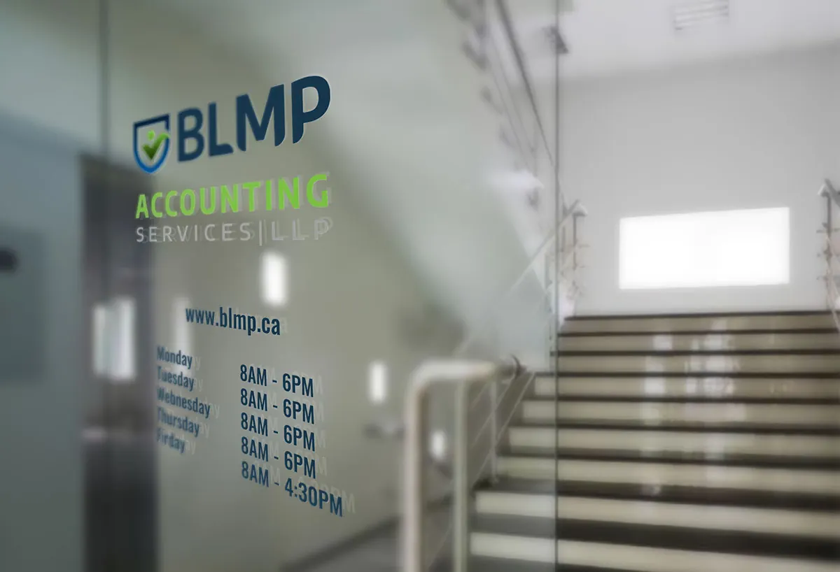 Glass office door with the BLMP logo, website address and opening hours.